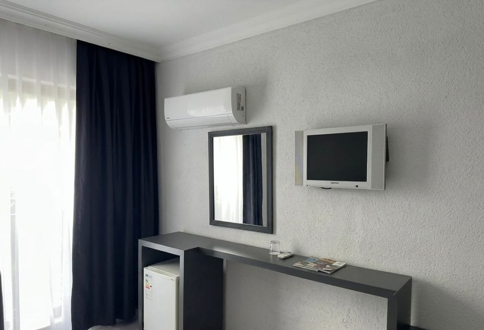In-room safe, desk, laptop workspace