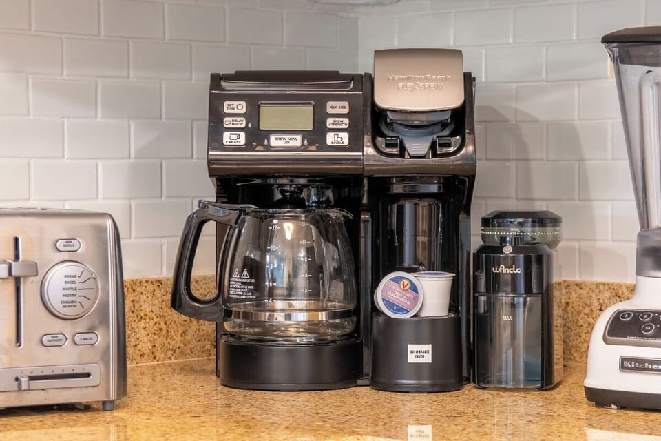 Start your morning right with this premium coffee station, featuring both drip and single-serve options to fuel your perfect getaway.