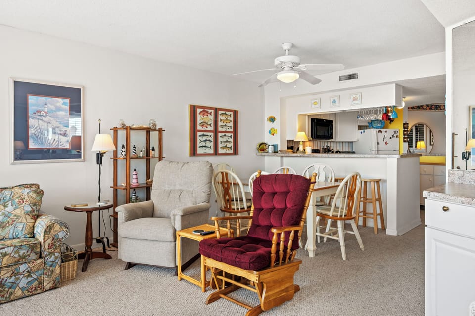 Relax in your cozy living area with comfortable seating, then whip up meals in the fully equipped kitchen - perfect for your home-away-from-home retreat.