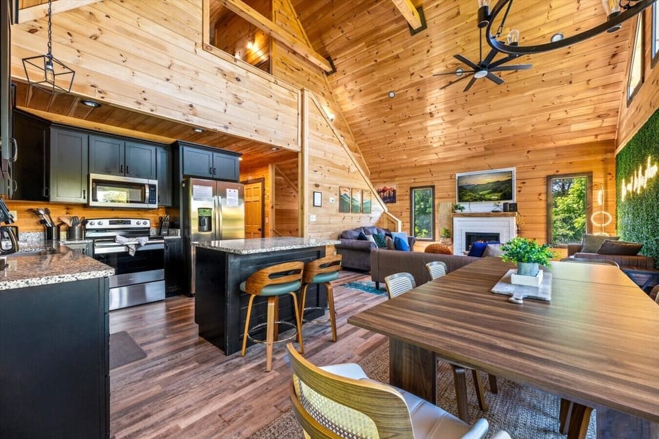 The spacious open-concept layout connects the kitchen, dining area, and living room, making it perfect for gathering with family and friends.