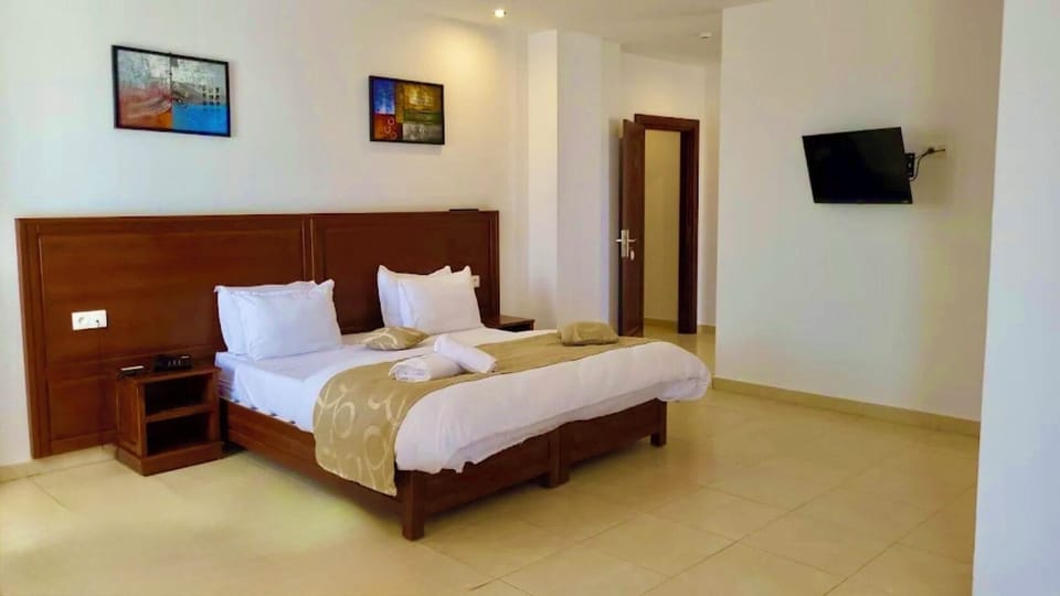 Double or Twin Room, City View | Desk, laptop workspace, WiFi (free), bed sheets
