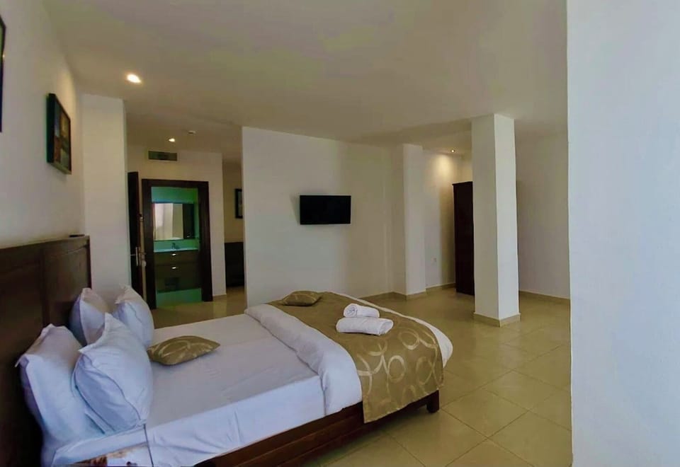 Double or Twin Room, City View | Desk, laptop workspace, WiFi (free), bed sheets