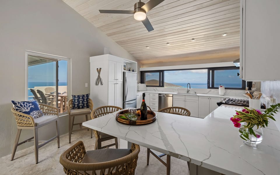 Gorgeous well stocked kitchen with a view of the ocean