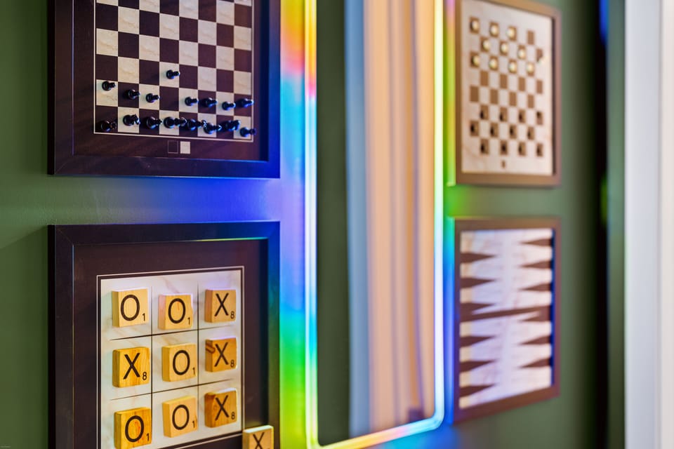 Interactive wall games and LED-lit mirror for added entertainment and style.