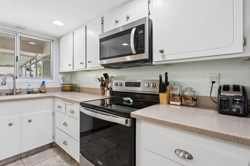 A bright, welcoming kitchen with plenty of room to prepare meals and settle into your stay.