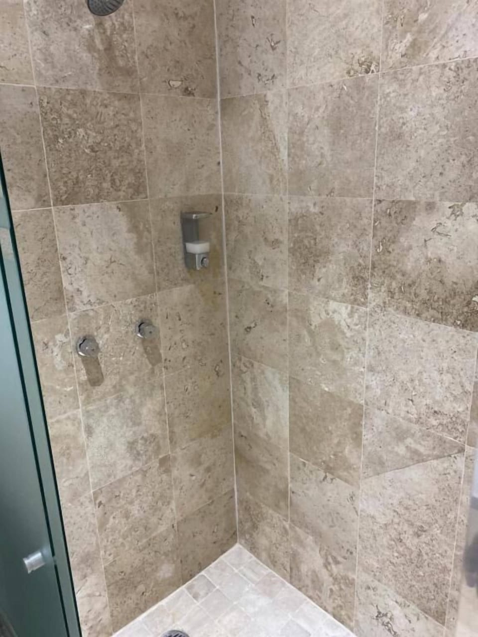 Shower, towels, shampoo, toilet paper