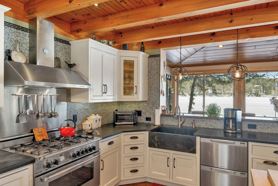 Delightful kitchen with lake winnipesaukee views and plenty of sitting space.