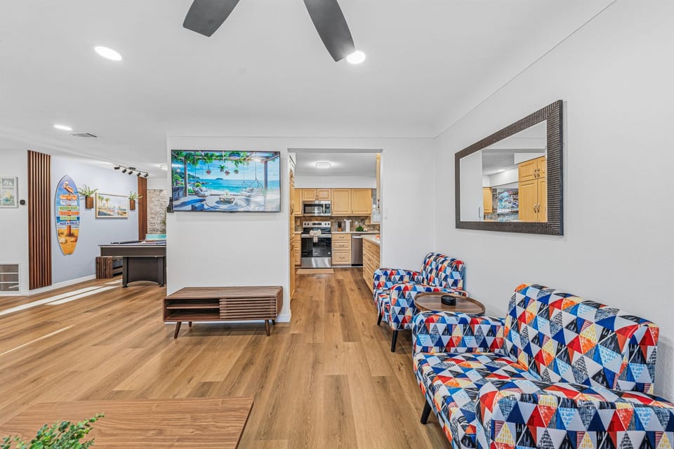 Large open layout connecting living, dining, and kitchen—perfect for groups to gather and enjoy 
