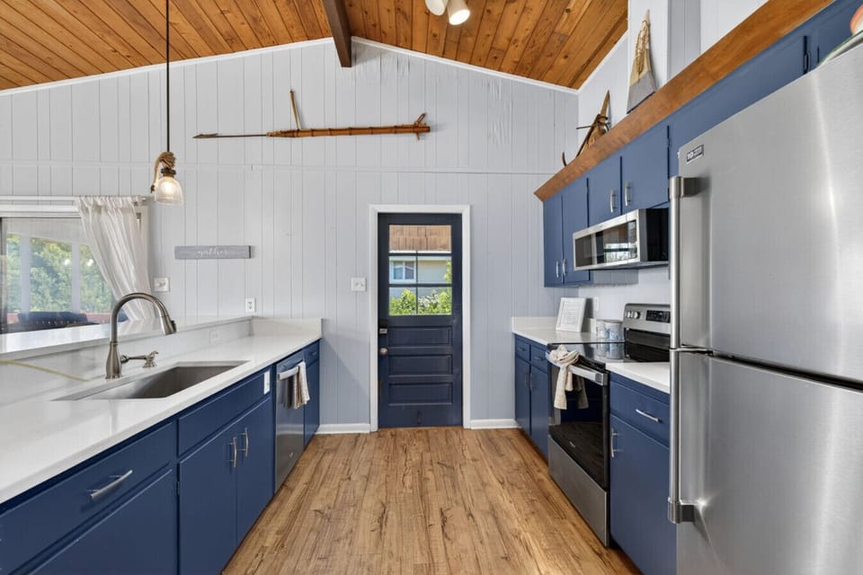 Beautifully updated and fully equipped, this coastal kitchen is ready for everything from pancake breakfasts to fresh seafood dinners.