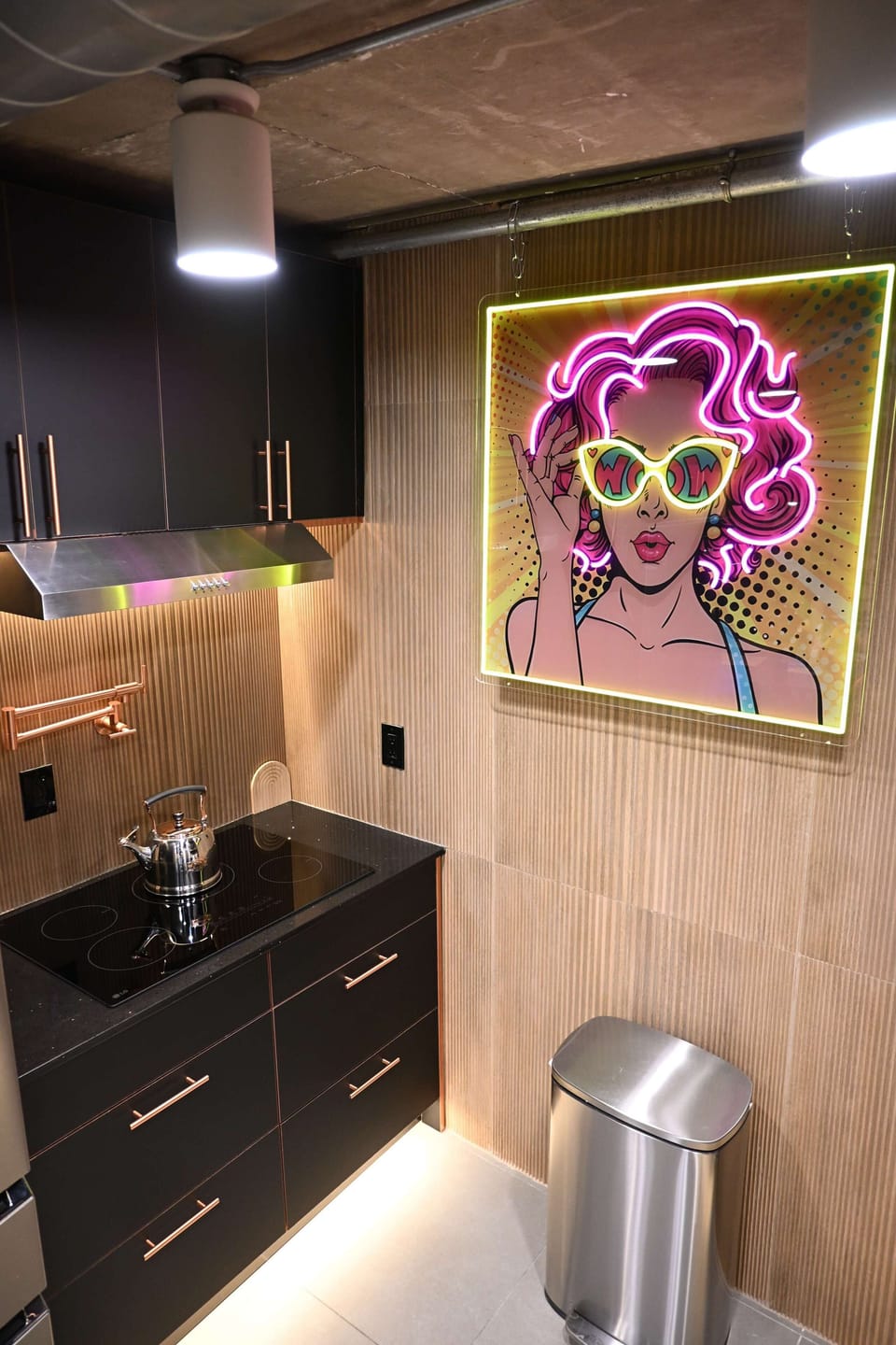 Chic kitchen space featuring a unique neon art piece, the perfect backdrop for your morning coffee.