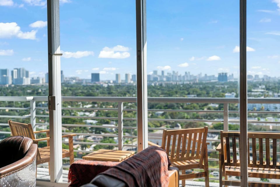 Bright and airy living space with panoramic windows showcasing the skyline.