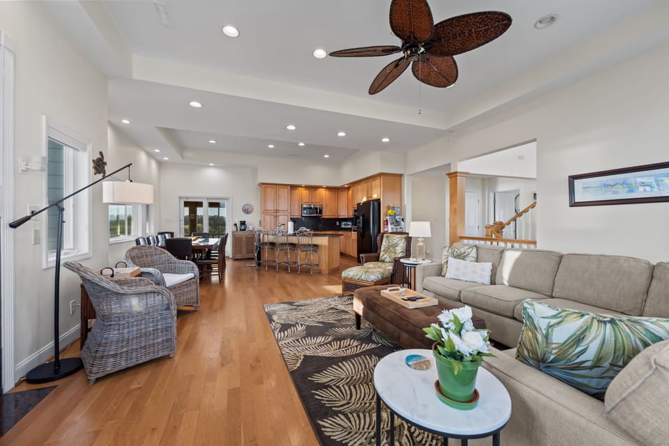 Spacious open layout connecting the living room, dining area, and kitchen for easy group gathering