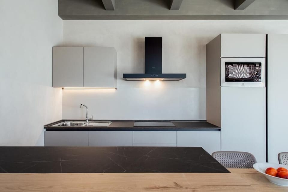 Apartment, Balcony, Pool View | Private kitchen | Fridge, microwave, stovetop, dishwasher