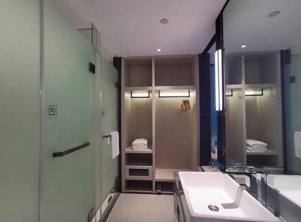 Shower, hair dryer, slippers, towels