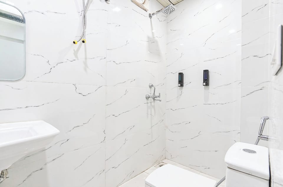 Shower, rainfall showerhead, slippers, towels