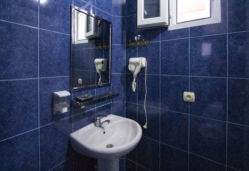 Comfort Quadruple Room, Balcony, City View | Bathroom | Shower, free toiletries, hair dryer, towels