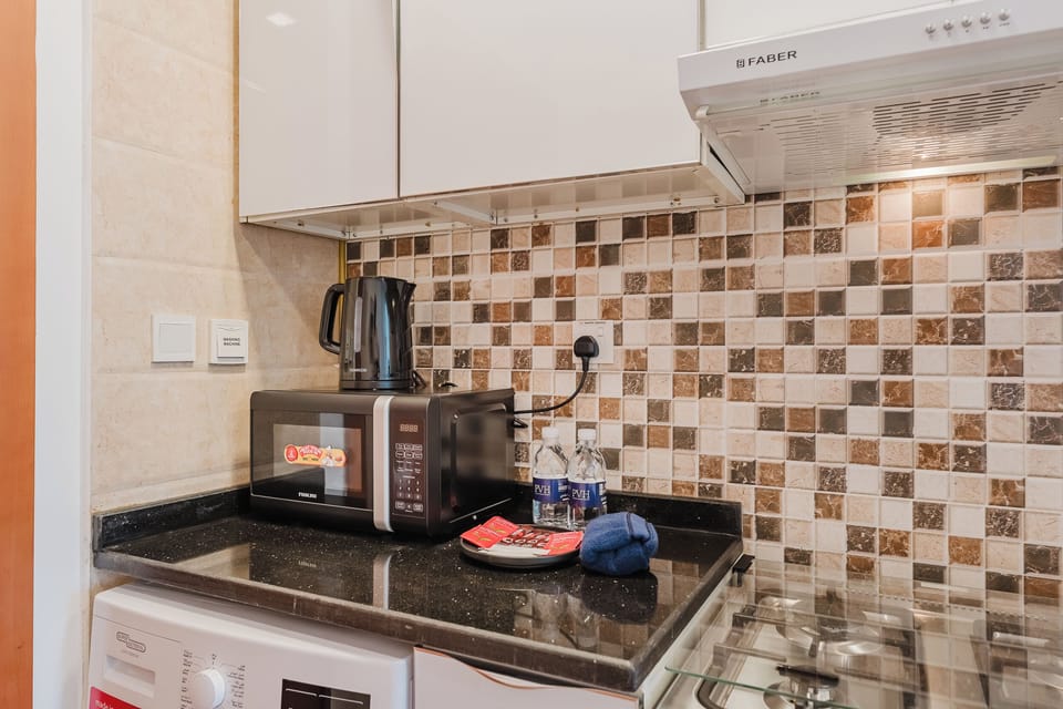 Exclusive Studio, Non Smoking, City View | Private kitchen | Full-size fridge, microwave, oven, stovetop