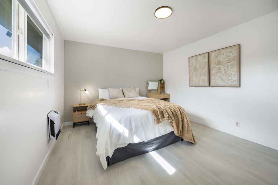 Bright and airy bedroom with clean, modern finishes and plenty of natural light.
