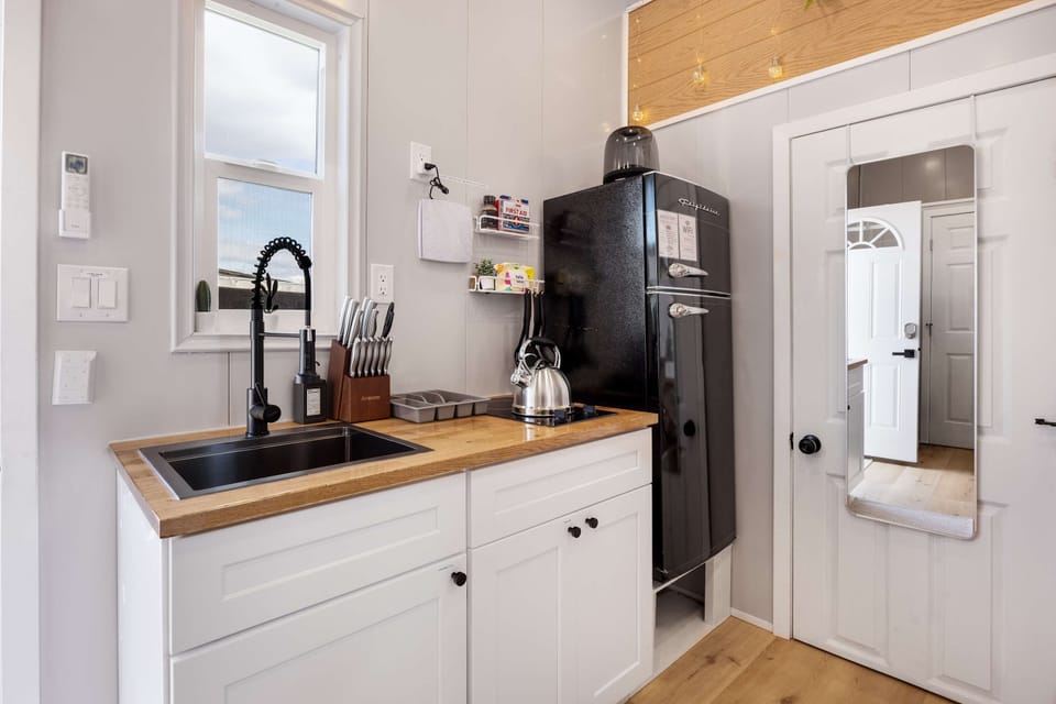 Compact kitchenette with modern finishes