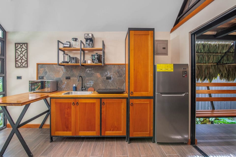 Fully equipped kitchen with breakfast bar and refrigerator in Caribbean Costa Rica vacation rental