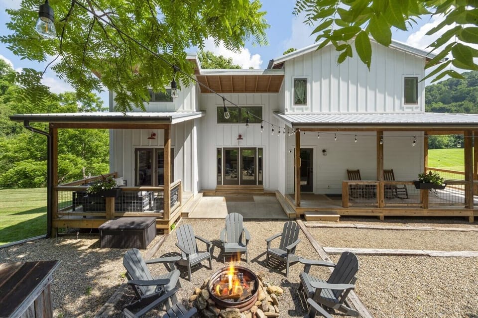 Enjoy this custom built farmhouse situated on acres of land, surrounded by mountainous views.