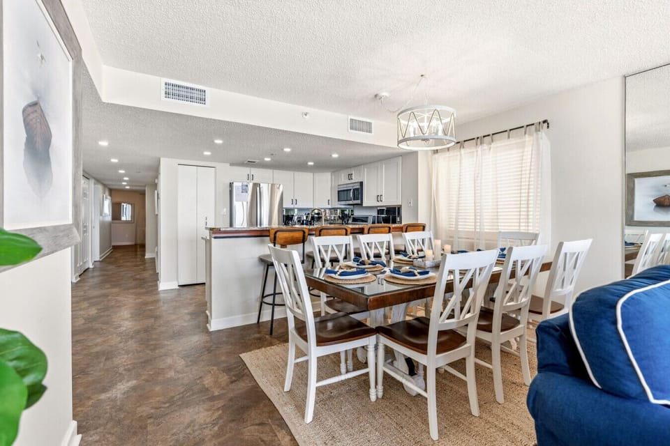 Gather, share meals, and make memories around a bright and inviting dining space perfect for groups.