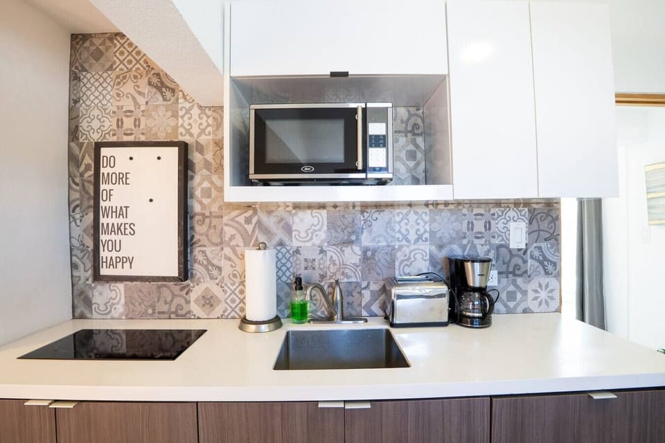 Kitchen setup with coffee maker and essentials