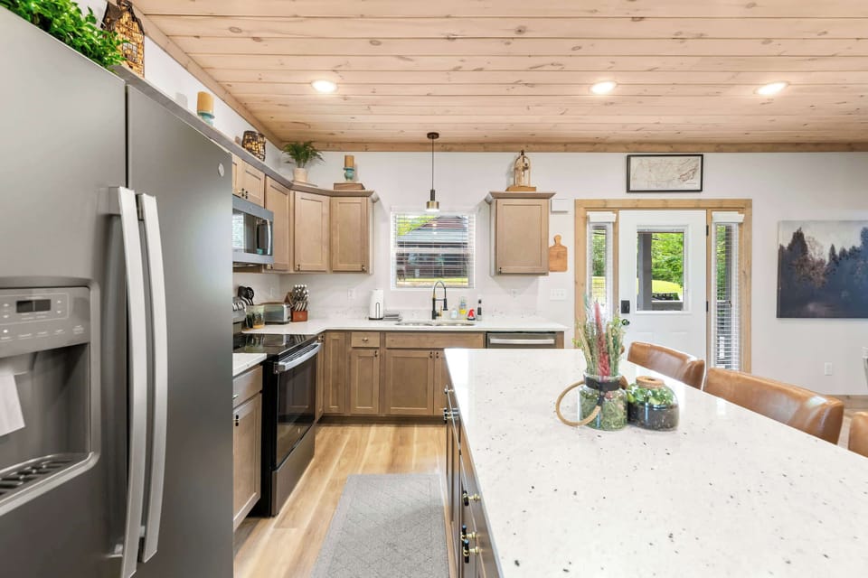 Fully equipped kitchen with island bar seating for 3. Perfect for chefs!