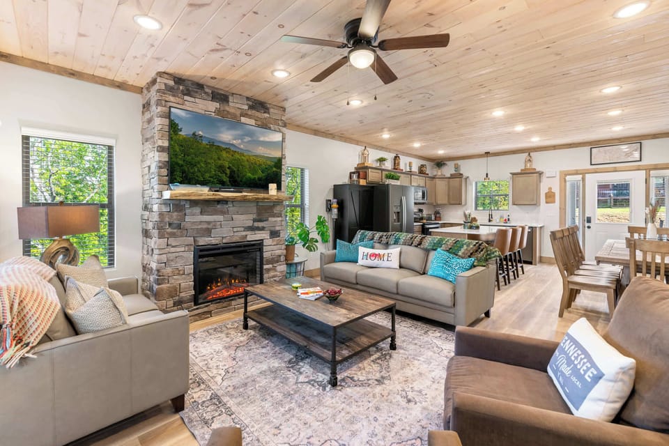 Cozy living room with fireplace, Smart TV, and mountain views.