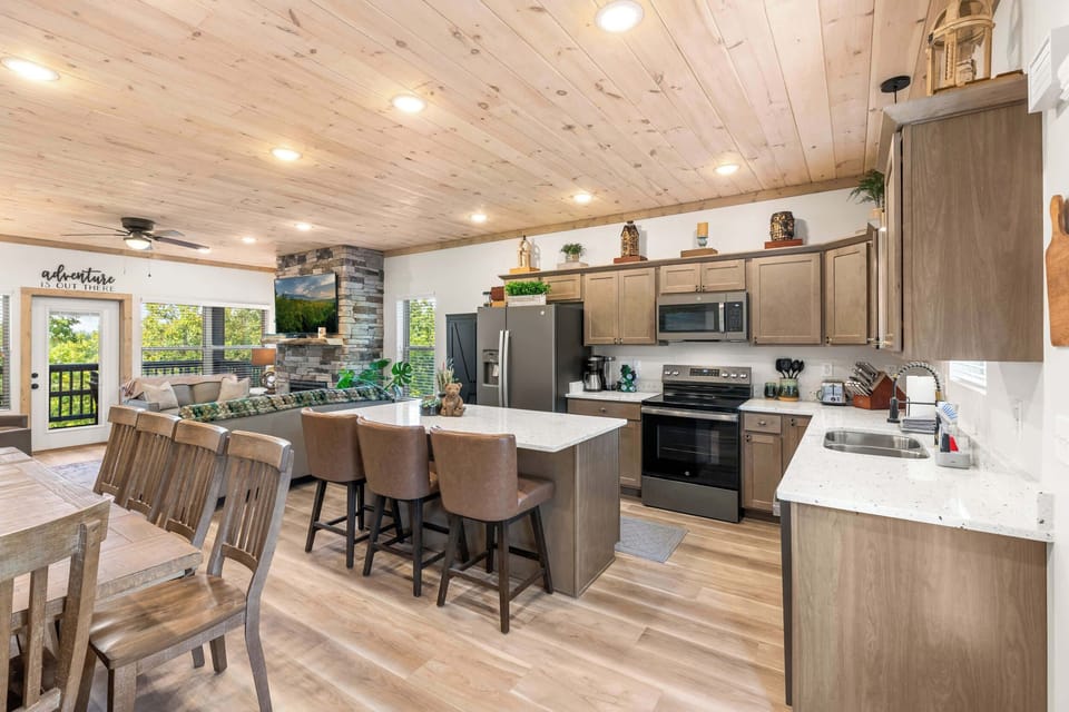 Fully equipped kitchen with island bar seating for 3. Perfect for chefs!