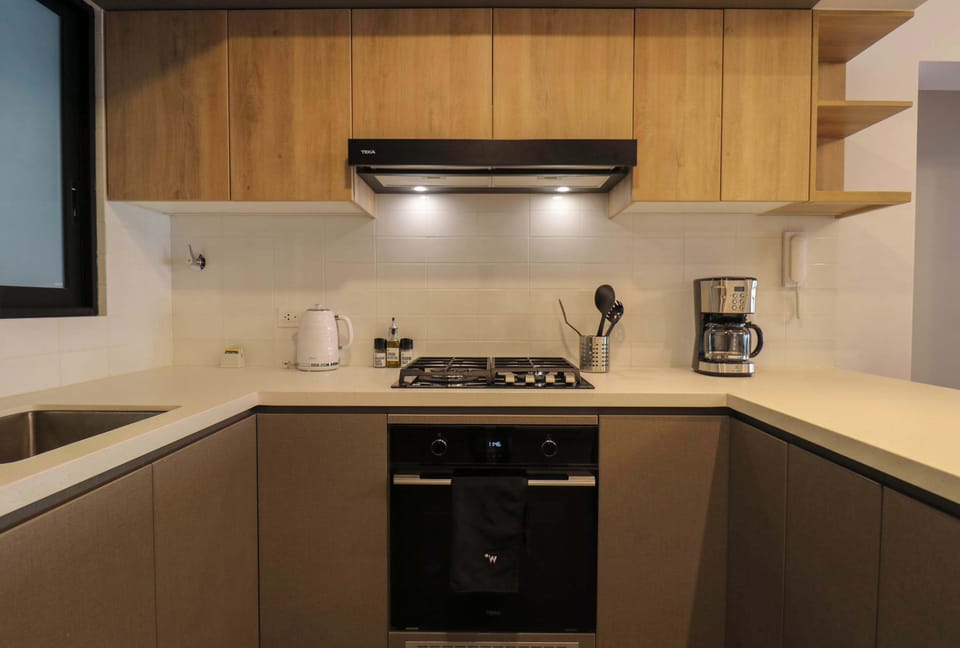 Ample kitchen space with essential cooking amenities
