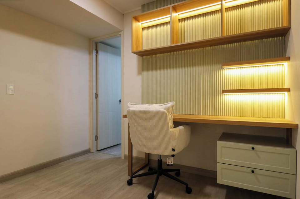 Functional workspace with storage and a comfortable chair.