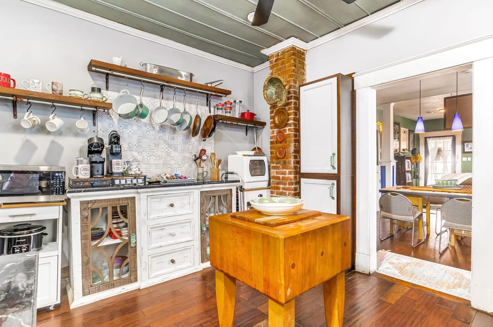 Bright, eclectic kitchen with gas cooking, vintage details, and everything you need to prepare meals and gather with family in East Hill.