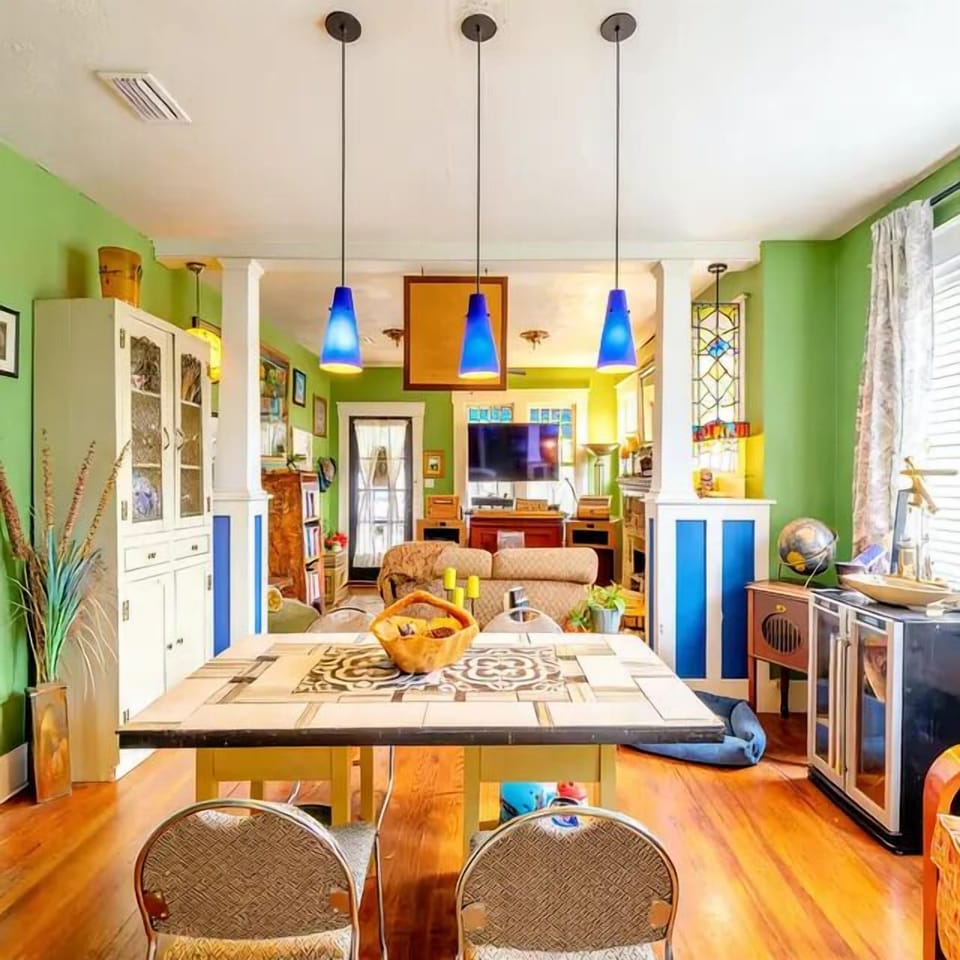 No two corners are the same — gather around a one-of-a-kind dining table inside a home that's pure Pensacola soul.