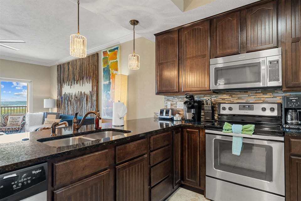The chic, open kitchen is well equipped for an unforgettable getaway​