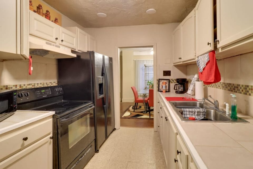 Kitchen | Electric Range | Stainless Refrigerator Tile Backsplash
