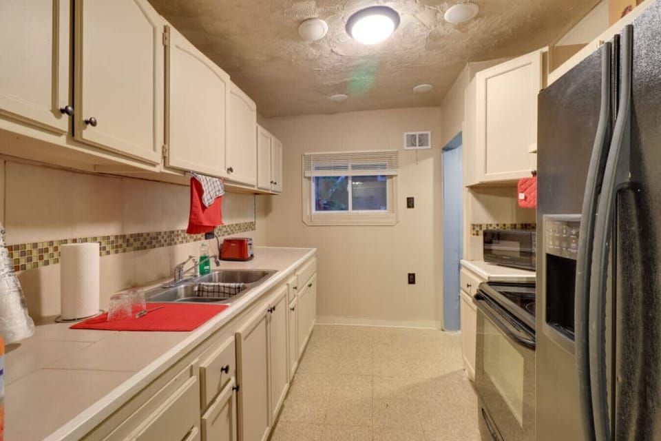 Kitchen | Double Basin Sink | Window View Upper Cabinets