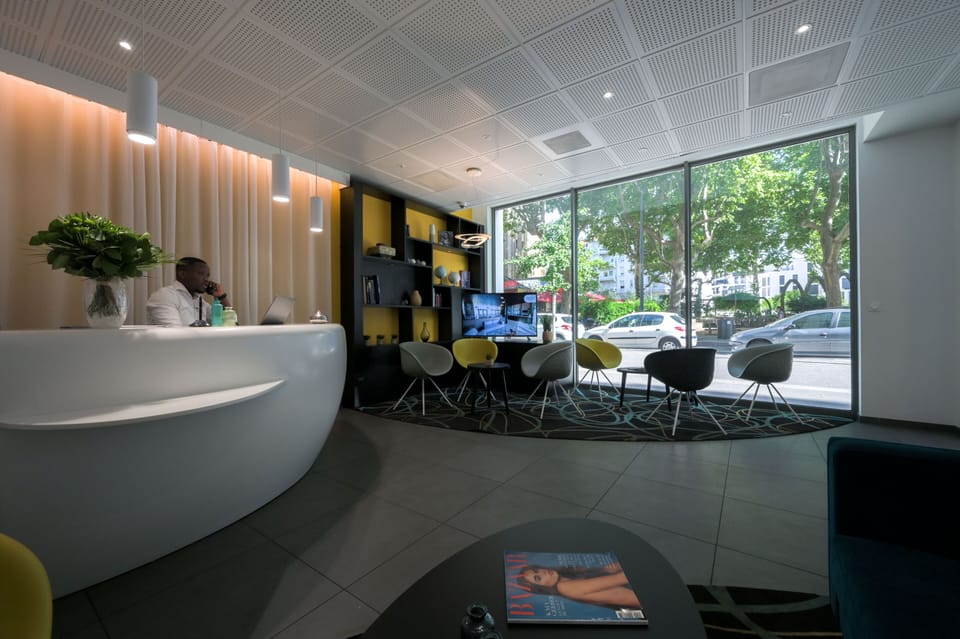 Stylish reception and lounge space with contemporary design just steps from Lyon Part-Dieu station.