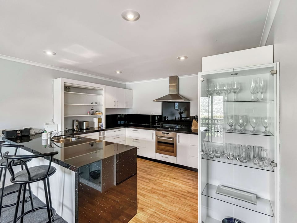 Open-plan kitchen with breakfast bar