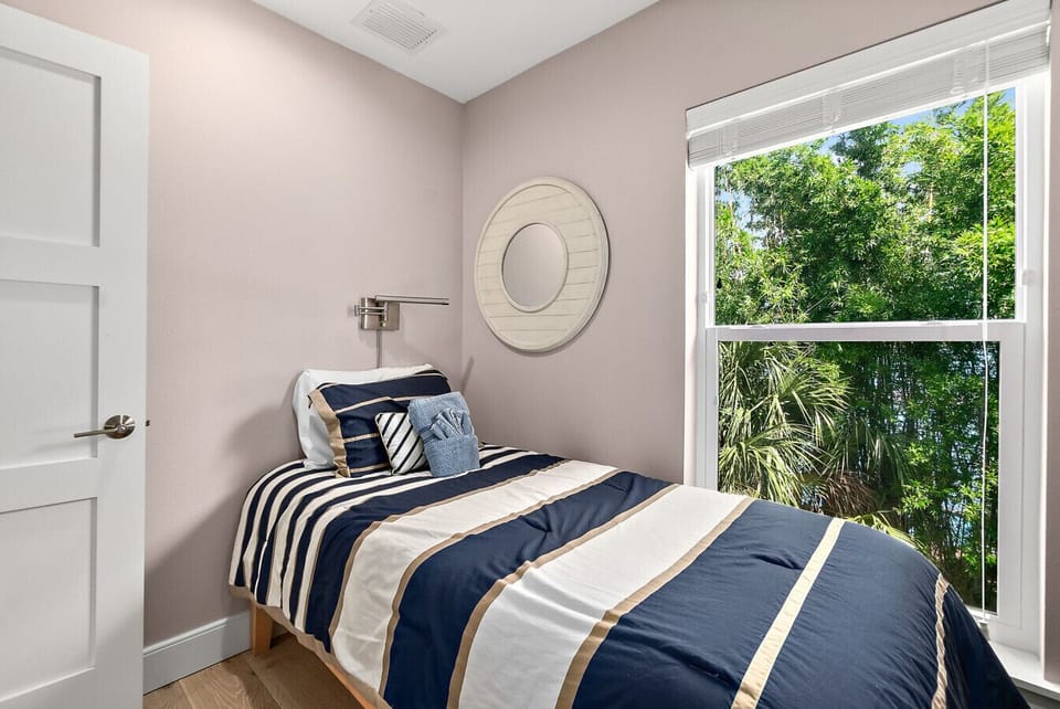 Bedroom with two twin beds and bright window