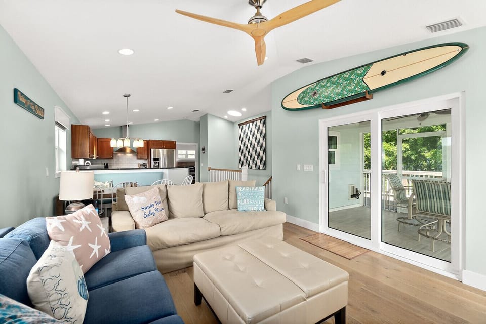 Open concept living area with easy flow to kitchen and patio