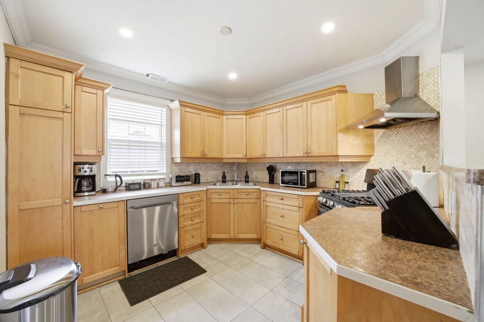 Prepare your favorite meals in a fully equipped space designed for convenience and flow. With ample counter room and modern appliances, this warm and functional kitchen is the heart of your perfect stay.