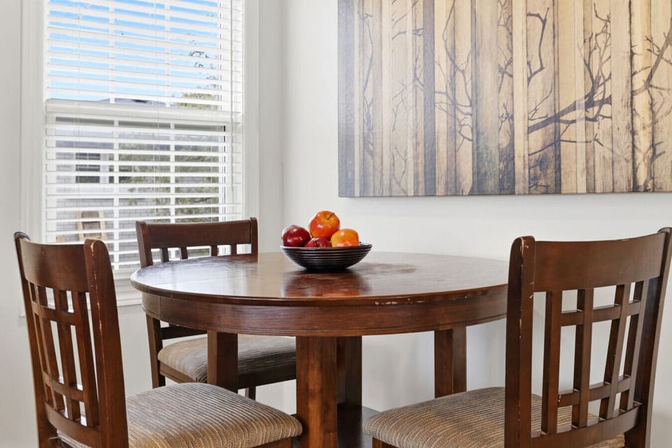 Start your morning with a fresh breeze and natural light in this inviting corner. Whether you are savoring a quiet breakfast or planning your day, this bright space offers a peaceful setting for every meal.