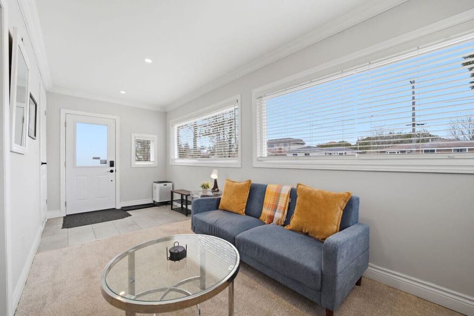 Step into a welcoming entryway that sets the tone for a bright and comfortable stay. This airy transition space leads you directly into the heart of the home, offering a refreshing first impression the moment you walk through the door.