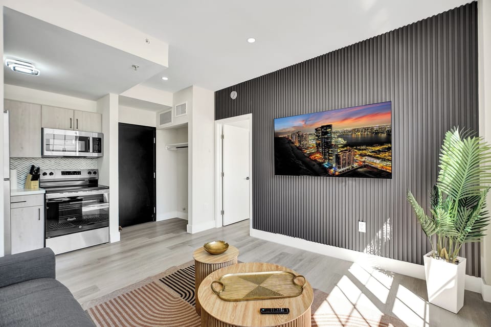 Standard 1 Bedroom Suite | Living area | 45-inch Smart TV with cable channels