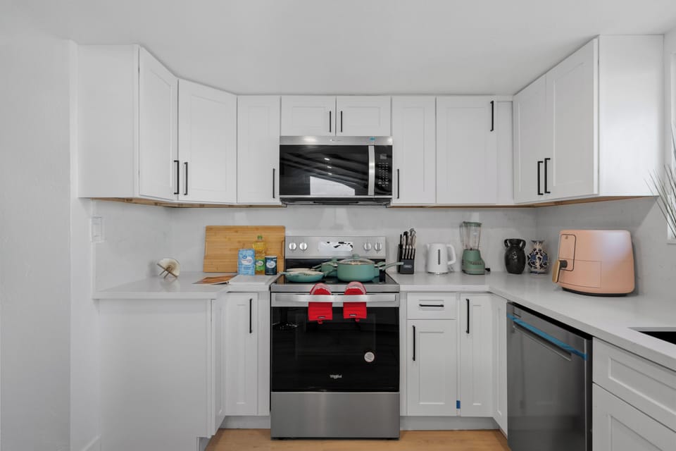 Modern kitchen stocked with appliances, utensils, and essentials.