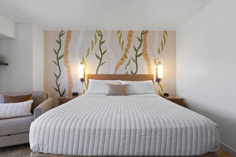 The plush bed, soft lighting, and island-inspired accents create a peaceful atmosphere for restful nights and slow mornings.