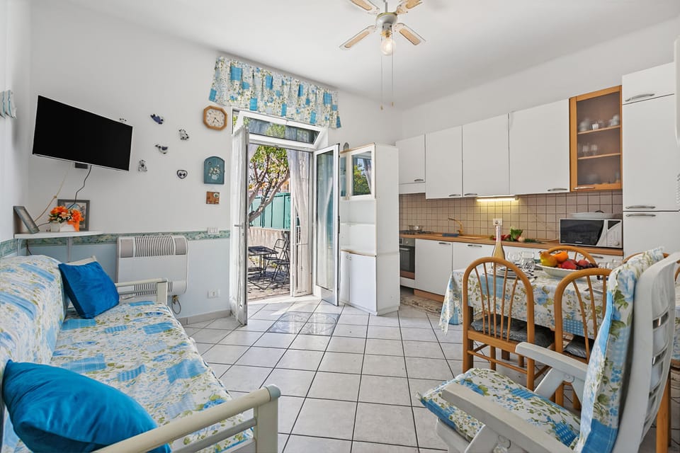 Family Apartment, Multiple Bedrooms, Sea Facing (Baia Serena) | Living area | Flat-screen TV