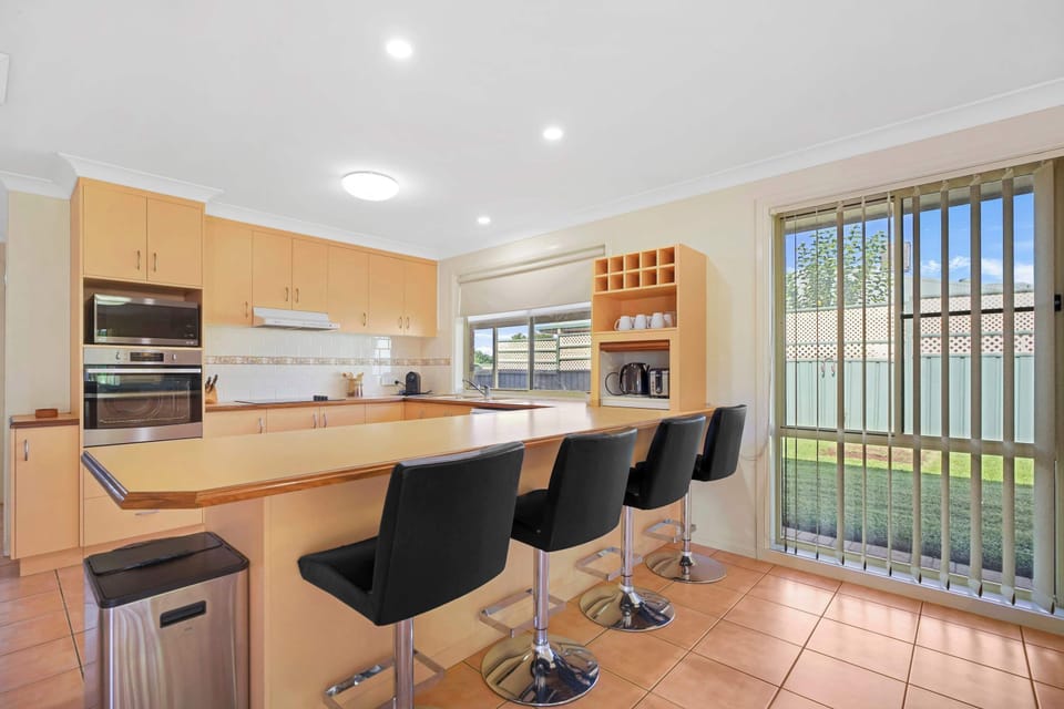 Kitchen + Coffee Pod Machine + Breakfast Bar with Stools