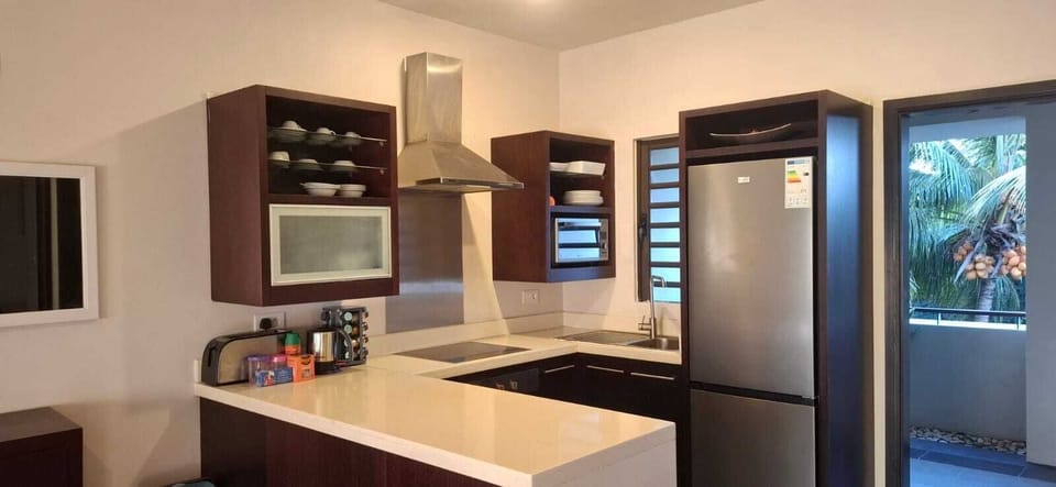 Deluxe Apartment, Multiple Beds, Balcony, Pool View | Private kitchen | Full-size fridge